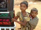 Older sibling (usually a girl) taking care of younger one in Shivrajpur, Jharkhand.