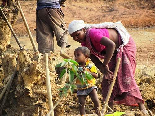 At a NREGA worksite in Bastar, Chattisgarh. Under the NREGA guidelines, a crèche at work site is mandatory, though I have never come across any.