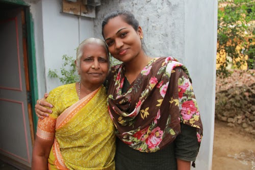 Gayathri (left) is a 'successful migrant' and is helping renovate the lavatories in the primary school in Melmayil